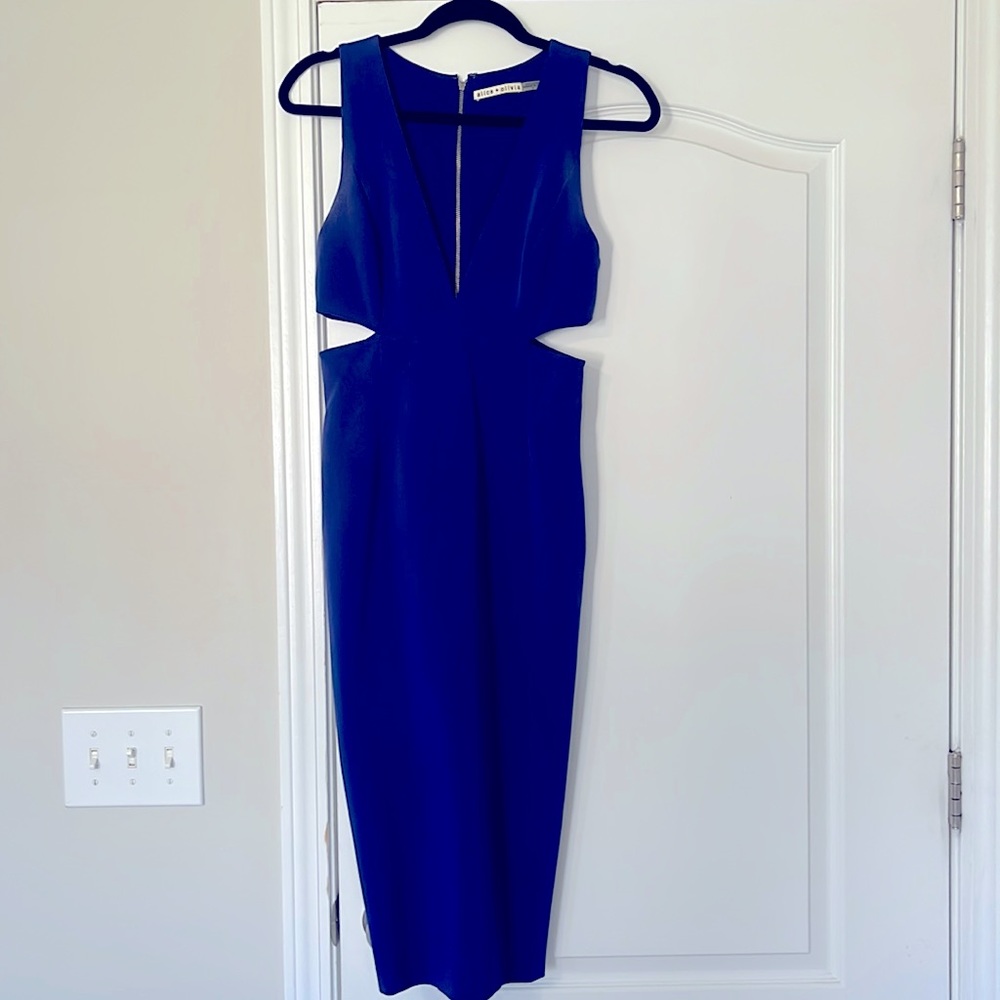 Navy dress with cut outs. Only worn once. Great condition!